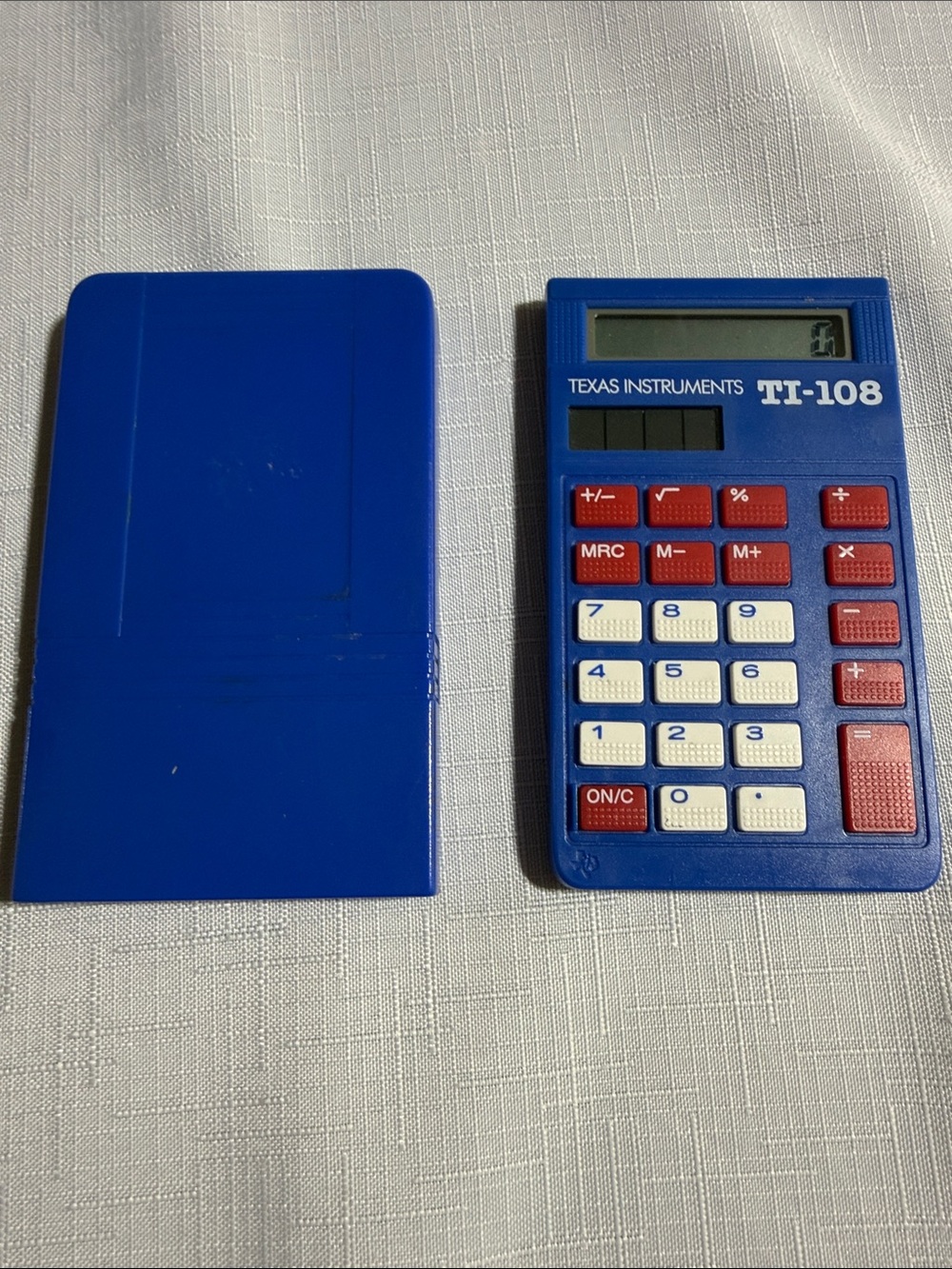 Texas Instruments TI-108 Pocket Calculator in Blue with Red and White Keys